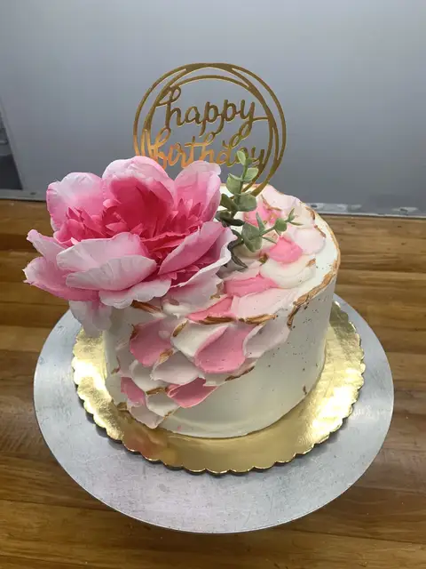 Birthday cake with pink flowers