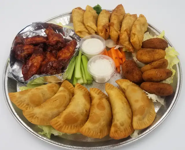 Savory party platter with pastels and chicken wings